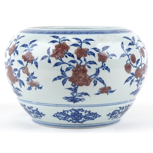 176 - A Chinese porcelain jardinière, 20th century, with hand painted in iron red and blue flowers, charac... 