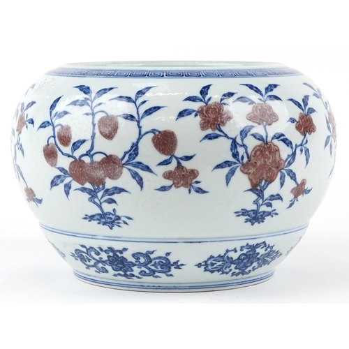 176 - A Chinese porcelain jardinière, 20th century, with hand painted in iron red and blue flowers, charac... 