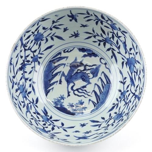  A large Chinese blue and white porcelain footed bowl hand painted with dragons chasing flaming pearl... 