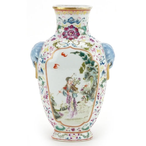 97 - A 20th century Chinese porcelain vase with ears, hand painted with figures in a courtyard amongst fo... 