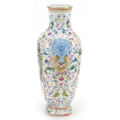 97 - A 20th century Chinese porcelain vase with ears, hand painted with figures in a courtyard amongst fo... 