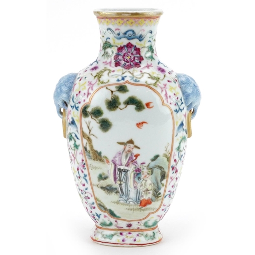 97 - A 20th century Chinese porcelain vase with ears, hand painted with figures in a courtyard amongst fo... 