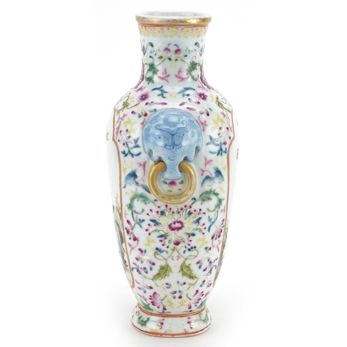 97 - A 20th century Chinese porcelain vase with ears, hand painted with figures in a courtyard amongst fo... 