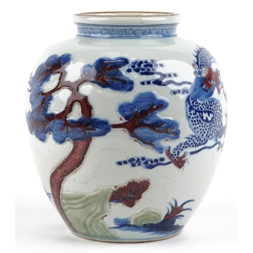 48 - A Chinese blue and white with iron red porcelain vase relief decorated and hand painted with a drago... 