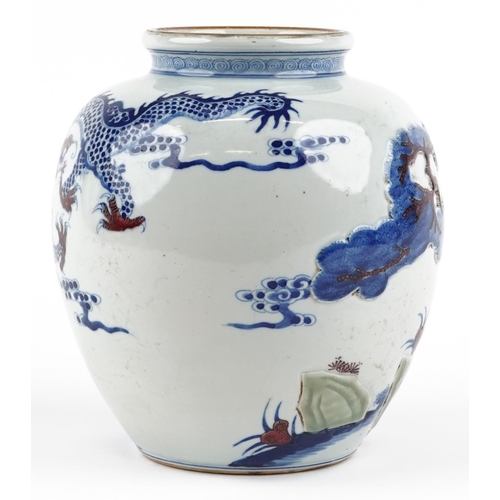 48 - A Chinese blue and white with iron red porcelain vase relief decorated and hand painted with a drago... 