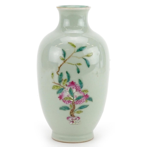 216 - A Chinese porcelain celadon glazed vase hand painted with fruiting vines, character marks to the bas... 