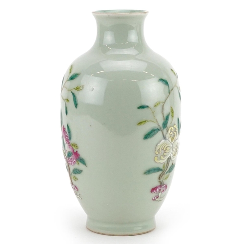 216 - A Chinese porcelain celadon glazed vase hand painted with fruiting vines, character marks to the bas... 