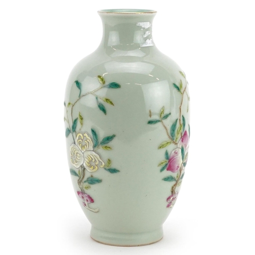 216 - A Chinese porcelain celadon glazed vase hand painted with fruiting vines, character marks to the bas... 