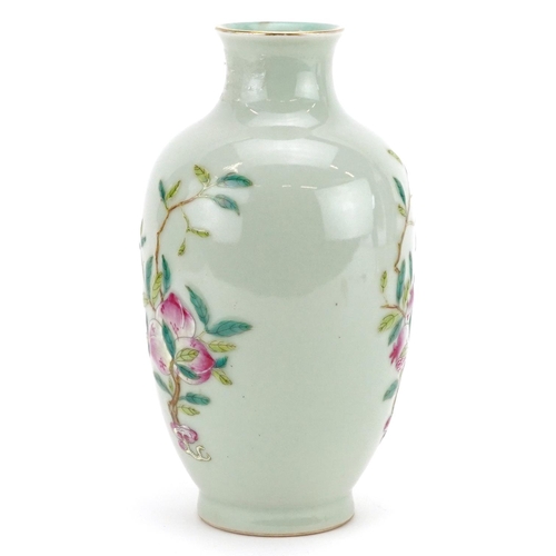 216 - A Chinese porcelain celadon glazed vase hand painted with fruiting vines, character marks to the bas... 