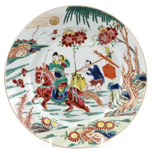 143 - A Chinese porcelain shallow dish hand painted with a figure on horseback crossing a river, 22.5cm in... 