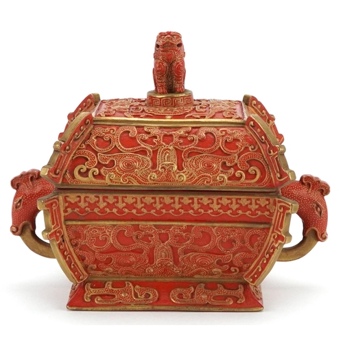 96 - A Chinese porcelain partially gilt box and cover in the form of a casket with mythical animal head h... 