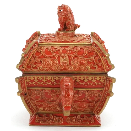 96 - A Chinese porcelain partially gilt box and cover in the form of a casket with mythical animal head h... 