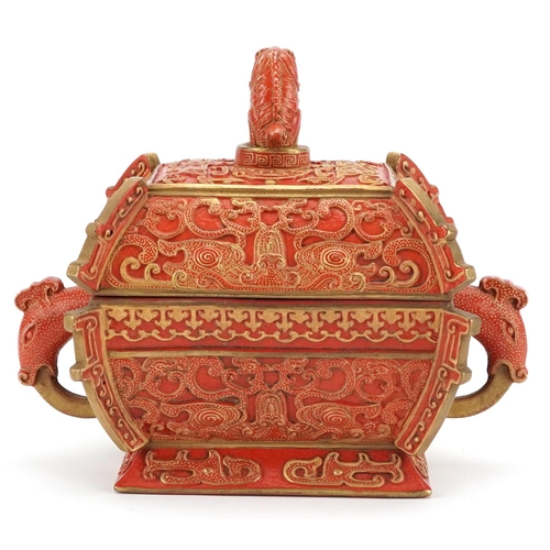 96 - A Chinese porcelain partially gilt box and cover in the form of a casket with mythical animal head h... 