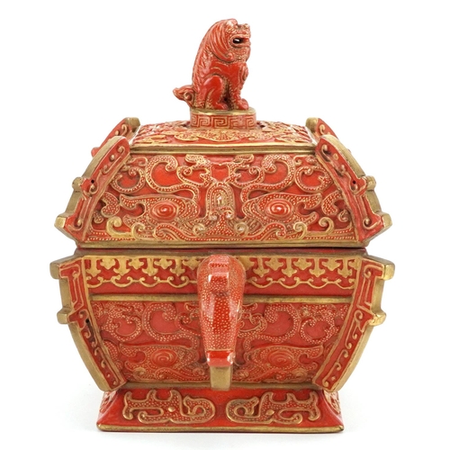 96 - A Chinese porcelain partially gilt box and cover in the form of a casket with mythical animal head h... 