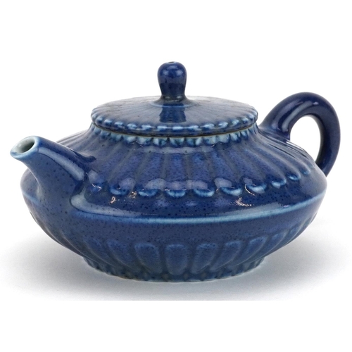 144 - A Chinese blue glazed porcelain teapot, character marks to the base, 15cm in length.