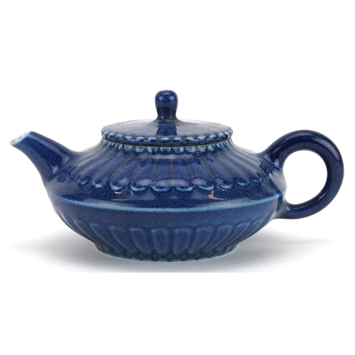 144 - A Chinese blue glazed porcelain teapot, character marks to the base, 15cm in length.