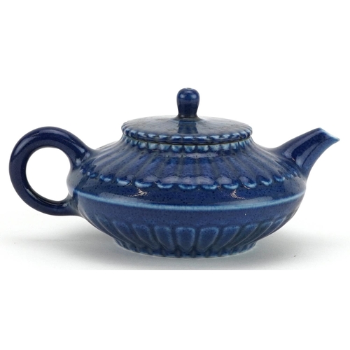 144 - A Chinese blue glazed porcelain teapot, character marks to the base, 15cm in length.