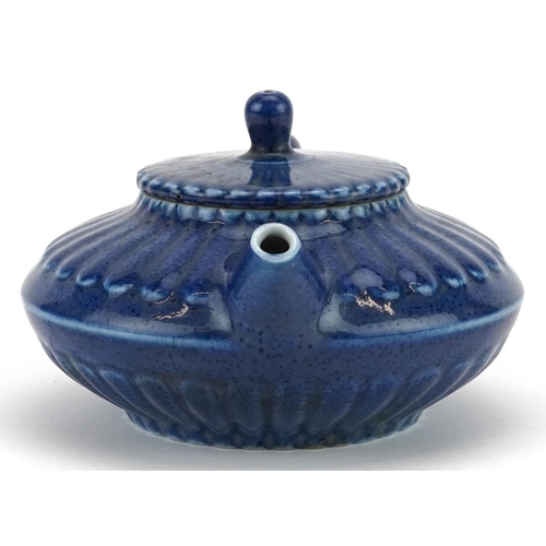 144 - A Chinese blue glazed porcelain teapot, character marks to the base, 15cm in length.