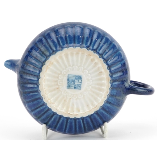 144 - A Chinese blue glazed porcelain teapot, character marks to the base, 15cm in length.