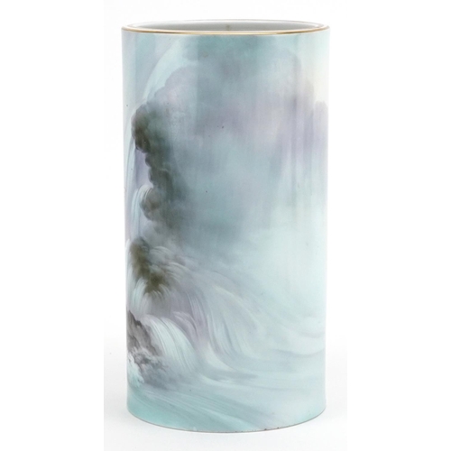 267 - A Japanese Noritake porcelain cylindrical vase hand painted with a fish in a waterfall, 25cm high.