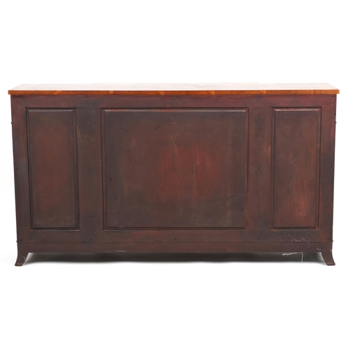 1030 - A late 20th century George III style breakfront walnut sideboard fitted with four frieze drawers abo... 