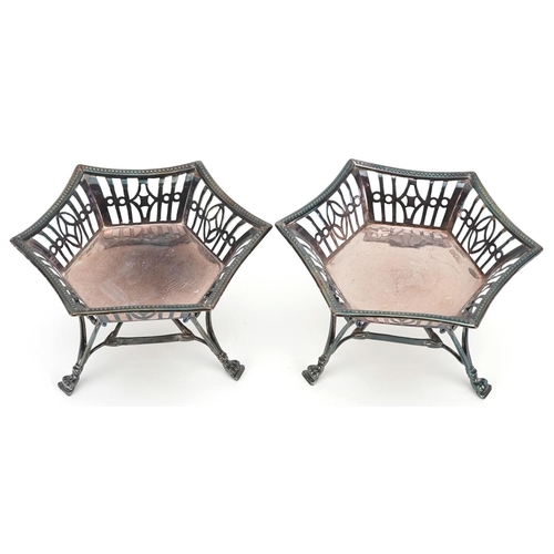 644 - H C Freeman & Co, a pair of Edwardian hexagonal pierced silver bonbon dishes raised on three feet, L... 