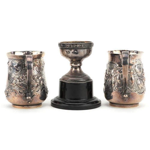 666 - Victorian and later silver comprising two christening tankards embossed with flowers and foliage and... 