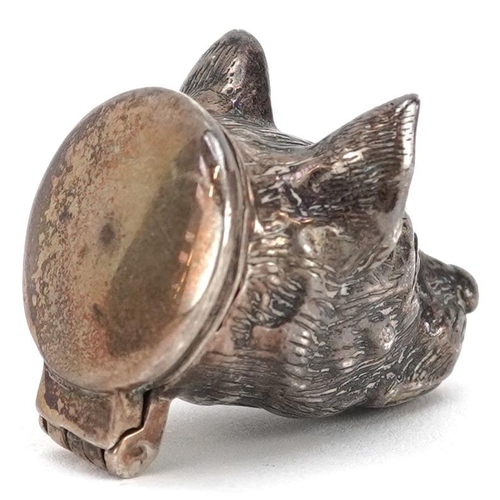 694 - A Victorian novelty silver pill box, with hinged lid in the form of a dog's head, 3.2cm in length, 2... 