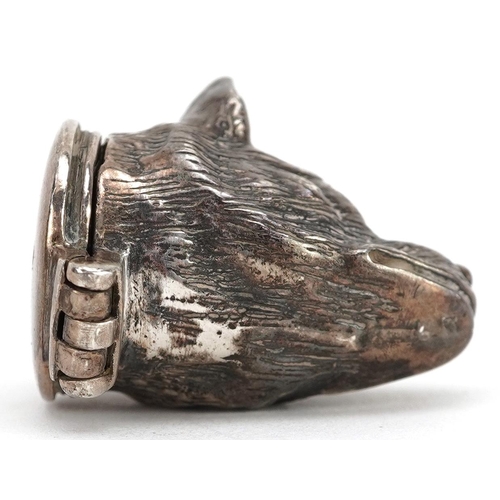 694 - A Victorian novelty silver pill box, with hinged lid in the form of a dog's head, 3.2cm in length, 2... 