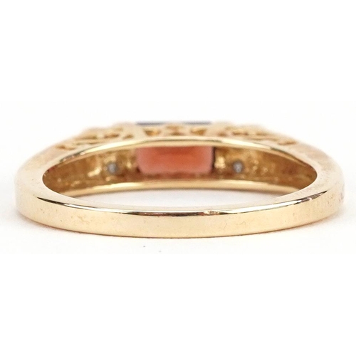 165 - A 14ct gold garnet and diamond ring, size N, 3.0g.