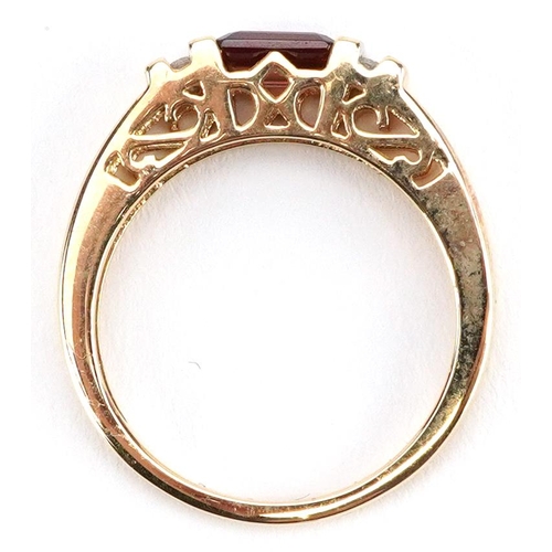 165 - A 14ct gold garnet and diamond ring, size N, 3.0g.