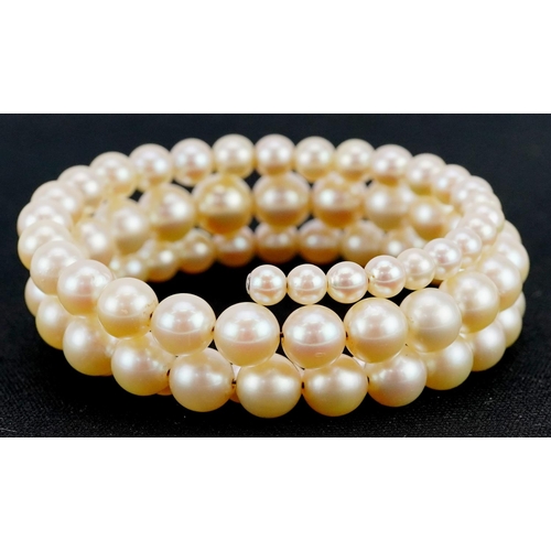 597 - A three row graduated cultured pearl bracelet, the largest pearl 8.2mm in diameter, total 30.4g.