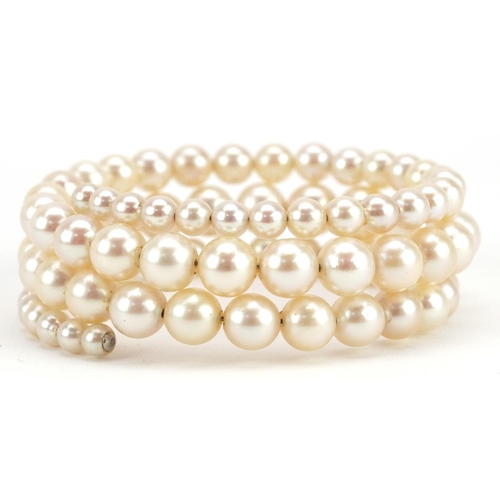 597 - A three row graduated cultured pearl bracelet, the largest pearl 8.2mm in diameter, total 30.4g.