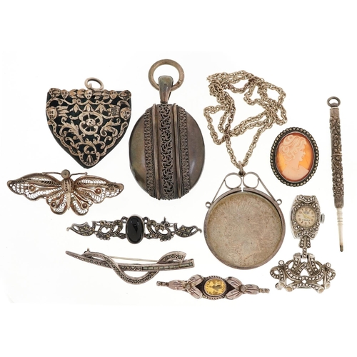 624 - A group of antique and later silver jewellery including a large Victorian style locket, 1922 Liberty... 