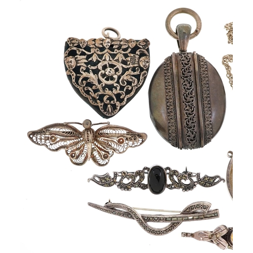 624 - A group of antique and later silver jewellery including a large Victorian style locket, 1922 Liberty... 