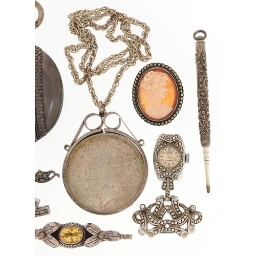 624 - A group of antique and later silver jewellery including a large Victorian style locket, 1922 Liberty... 