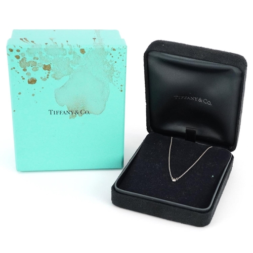 413 - A Tiffany & Co silver necklace set with a diamond solitaire, designed by Elsa Peretti, with box and ... 