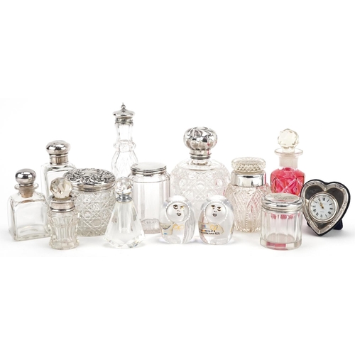 700 - A collection of Victorian and later silver mounted cut glass jars and scent bottles together with a ... 