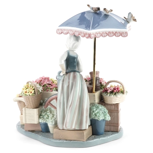 726 - A Lladro figure of a flower seller - Flowers of the Season, numbered 1454, 28cm high.