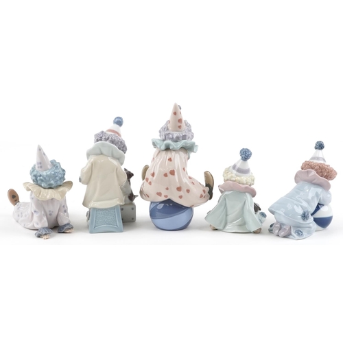 773 - Five Lladro figures of clowns - Pierrot with Puppy, Tired Friend, Pierrot with Concertina numbered 5... 