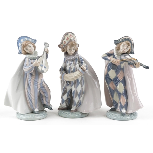 771 - Three Lladro figures of Harlequin playing music - Mandolin Serenade numbered 5694, Concertina number... 