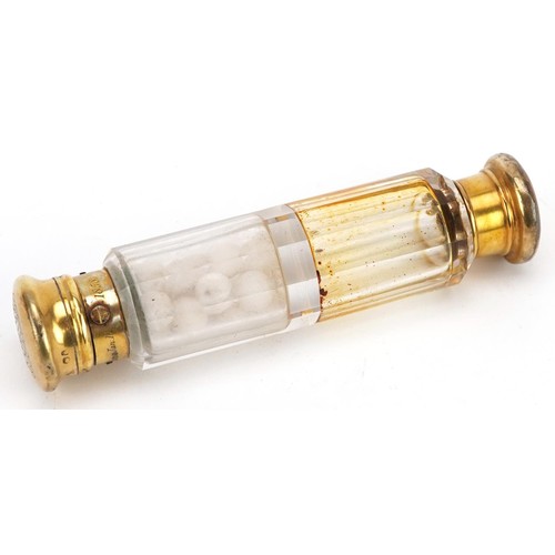 680 - A Victorian silver gilt double end cut glass scent bottle housed in a velvet and silk lined fitted c... 