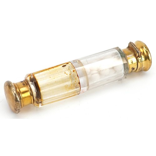 680 - A Victorian silver gilt double end cut glass scent bottle housed in a velvet and silk lined fitted c... 