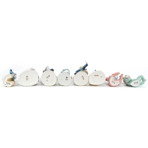 778 - Eight Nao porcelain figures including Airy Clown, the box numbered 00488, Clown with Ball, the box n... 