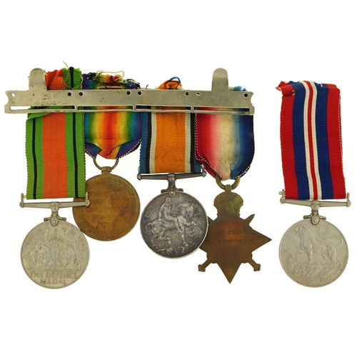 655 - A British military World War I medal trio and two World War II medals, the World War I group awarded... 