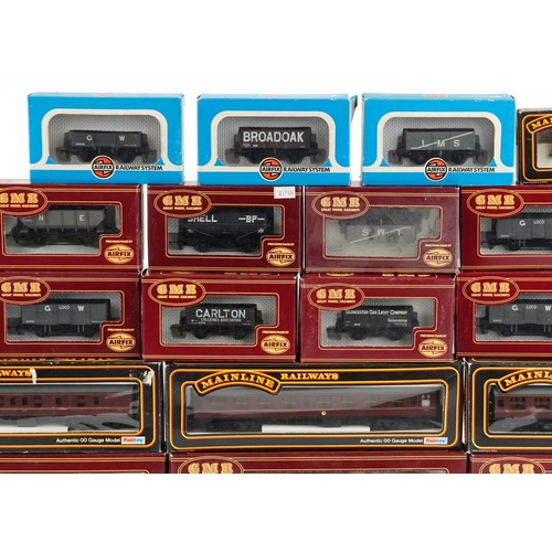 514 - A collection of Airfix and Palitoy die cast model railway coach sets and wagons.