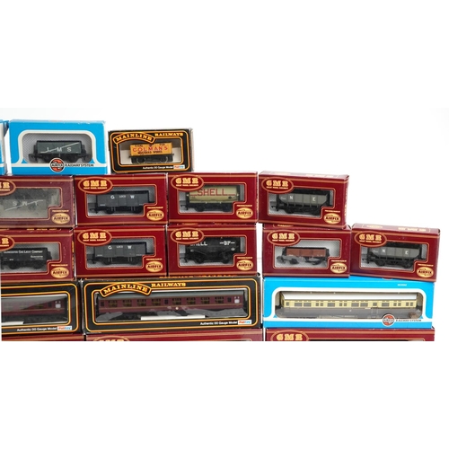 514 - A collection of Airfix and Palitoy die cast model railway coach sets and wagons.