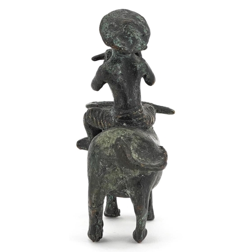 147 - A Chinese bronze figure group of man on the back of a water buffalo, 20th century, 10cm high.