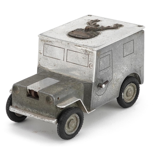 A German Baier 1947 aluminium table cigarette lighter and box in the form of an army truck, 14cm in length.