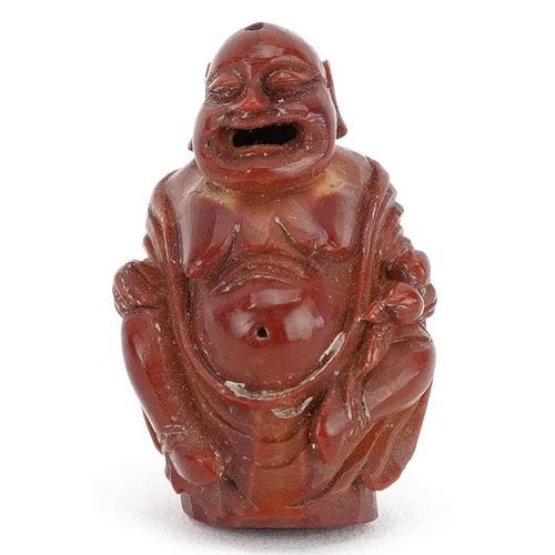 106 - A small Chinese carved nut in the figure of a Buddha, late 19th/early 20th century, 2cm high.